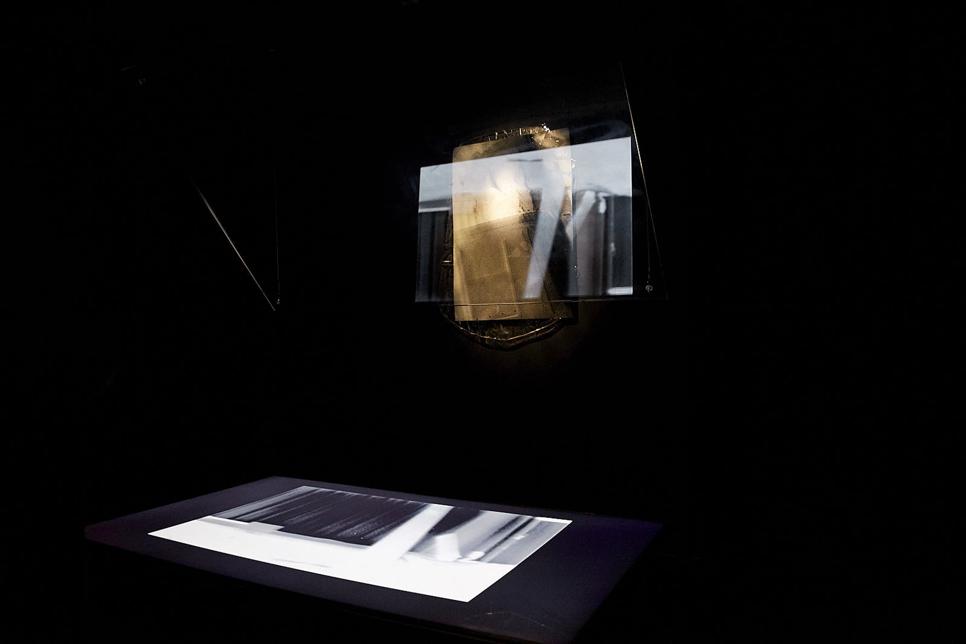 <p><i>Sequence</i>, 2020. glass panel, LCD screen, giclee photographic prints set In epoxy resin, metal rope, varying sizes Installation View, SIT Gallery, 2020</p>